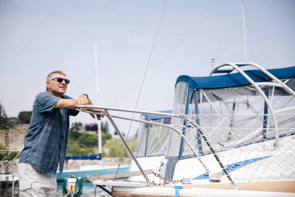 Older gentleman at the boat dock. Older gentleman at the boat dock.
