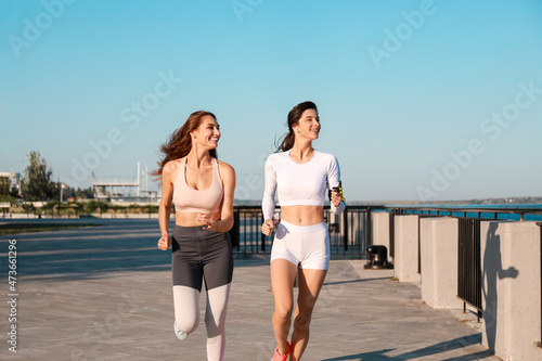 Sporty young women running in park