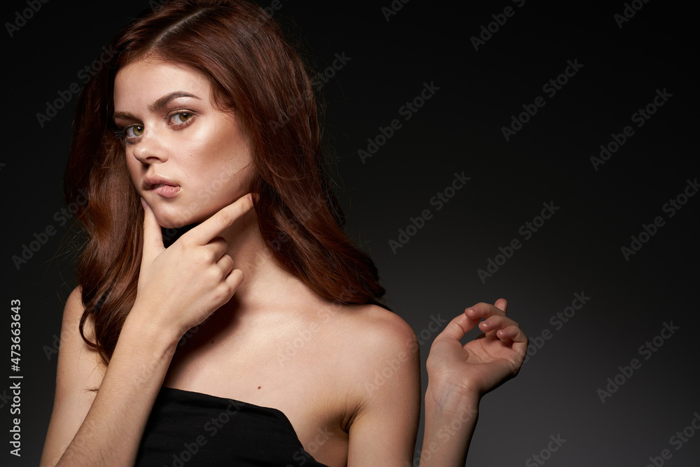 sexy woman makeup posing naked shoulders hairstyle dark background