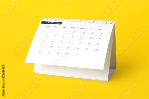 Classic flip paper calendar for March 2022 on yellow background
