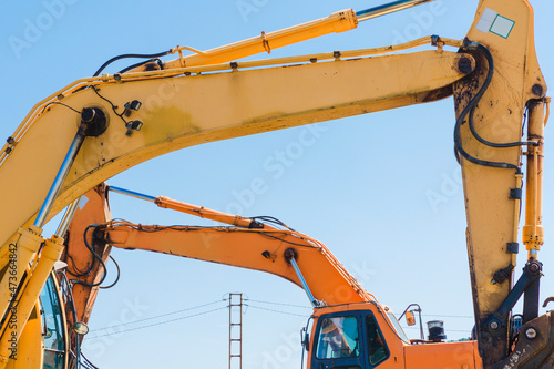 Yellow and orange excavator close-up