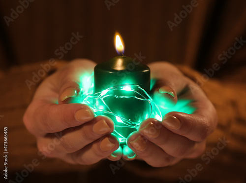 Hands holding a burning gre...