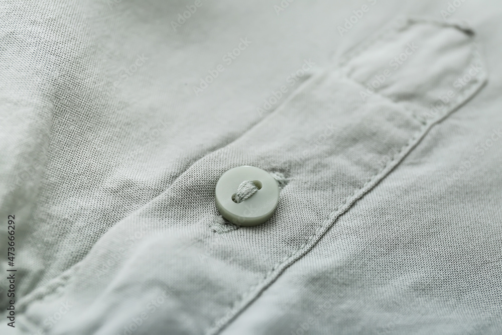 Button on stylish shirt, closeup Button on stylish shirt, closeup