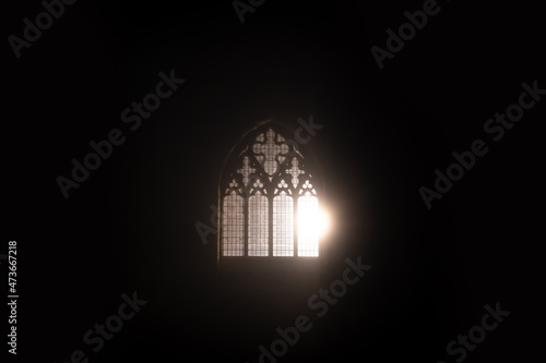 A church window glowing at night photo