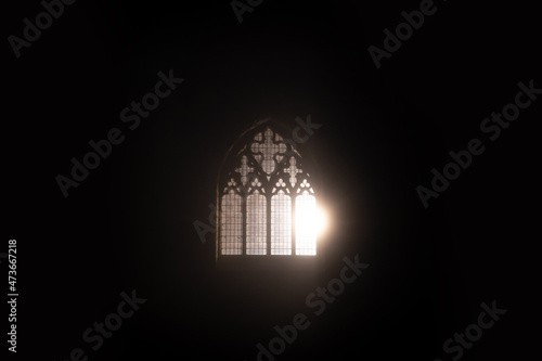A church window glowing at night
