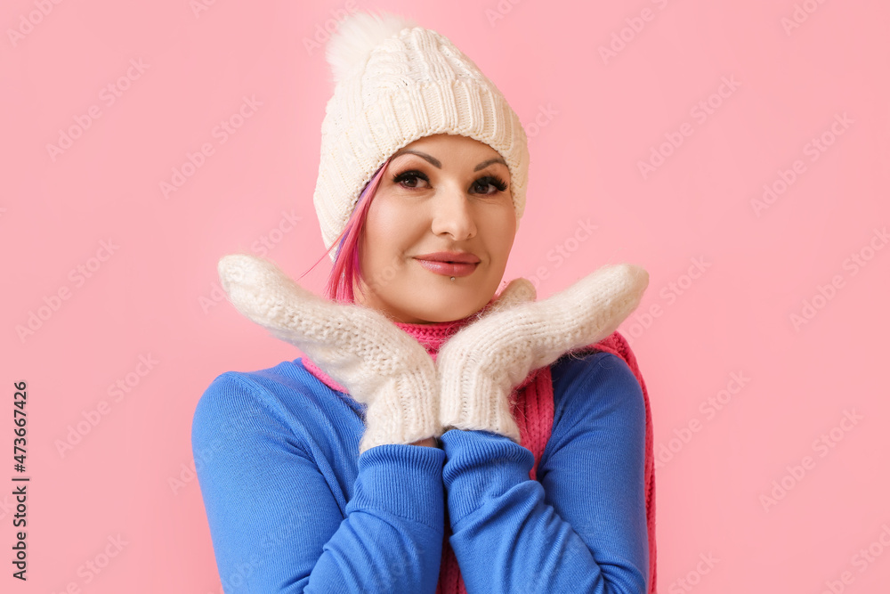 Woman in winter clothes on color background Woman in winter clothes on color background