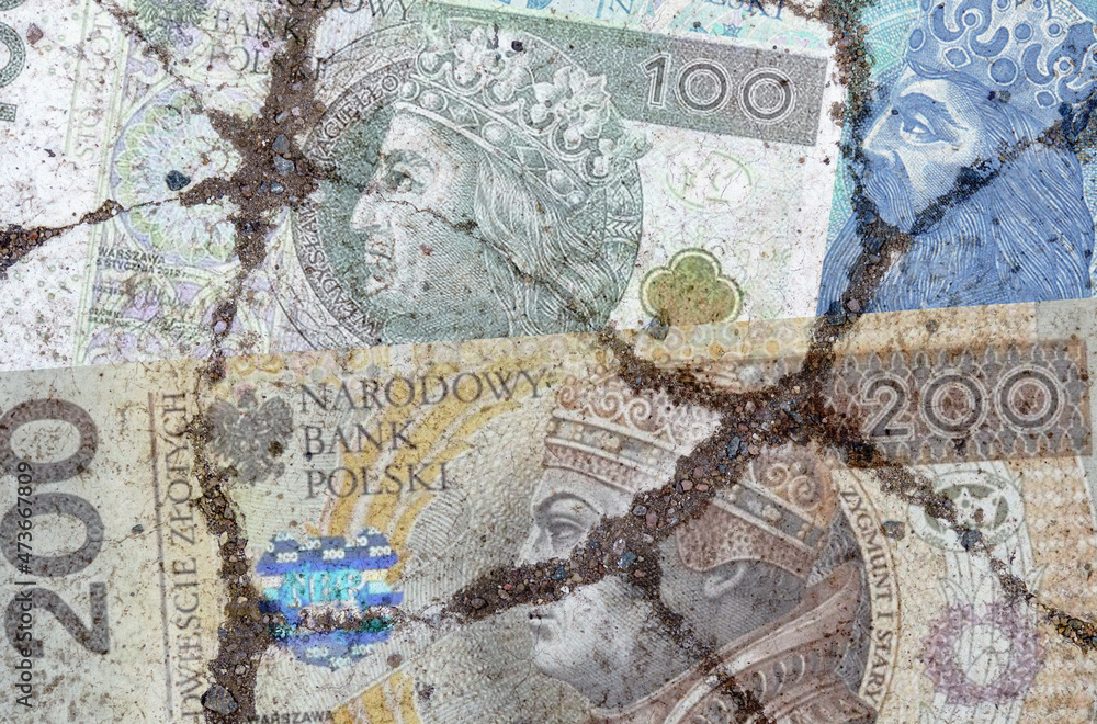 On the cracked asphalt there is an image of the Polish zloty.