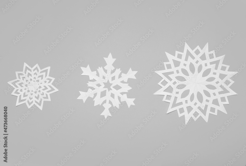 Beautiful paper snowflakes on light background Beautiful paper snowflakes on light background