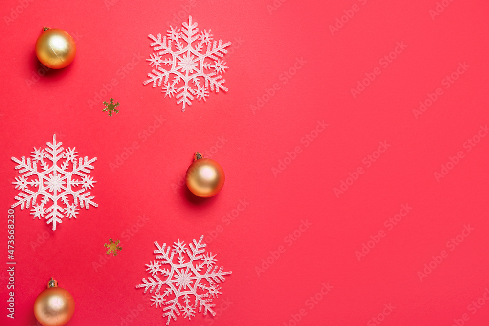 Beautiful snowflakes and Christmas balls on red background Beautiful snowflakes and Christmas balls on red background