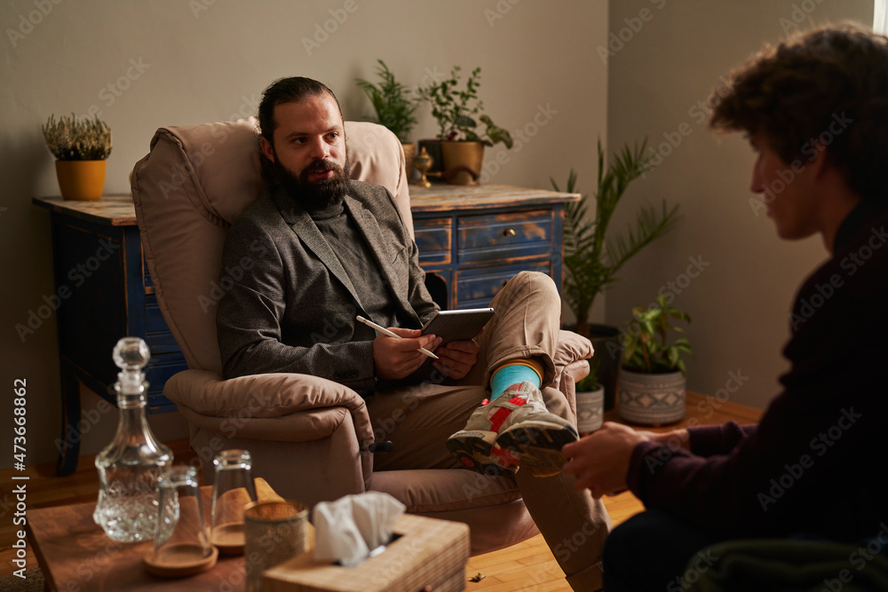 A therapist talking to his patient A therapist talking to his patient