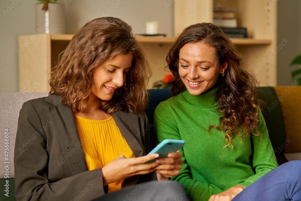 Gay couple looking at a mobile phone Gay couple looking at a mobile phone