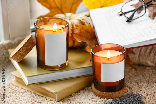 Burning candles in holders,...