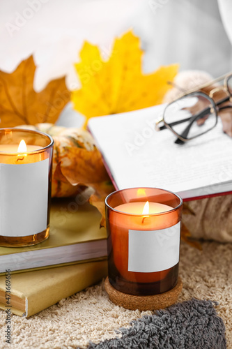 Burning candles in holders,...