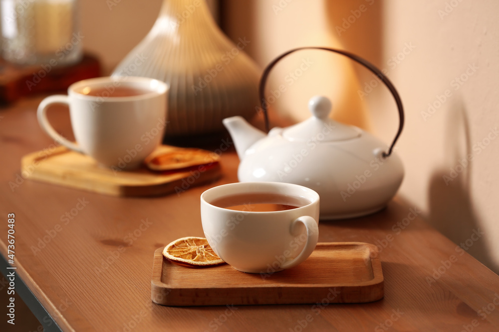 Cups of tasty tea on table in cafe Cups of tasty tea on table in cafe
