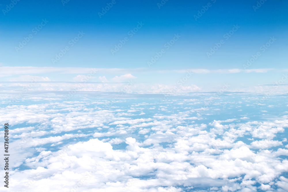 Clouds patterns on blue sky backgroun , aerial view from airplane window