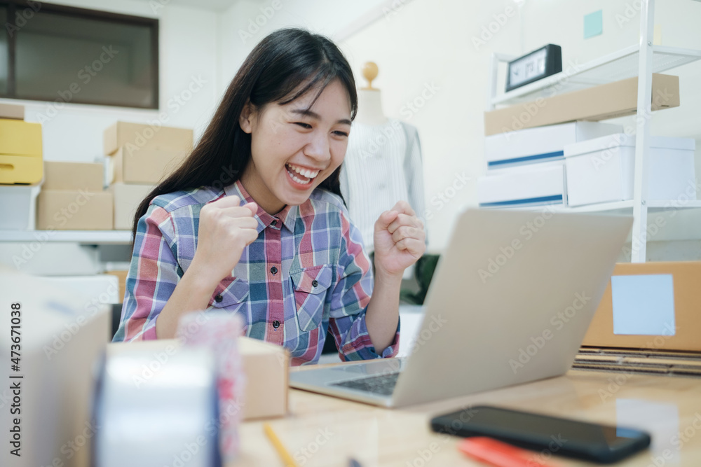 Young asian women happy after new order from customer. Young asian women happy after new order from customer.
