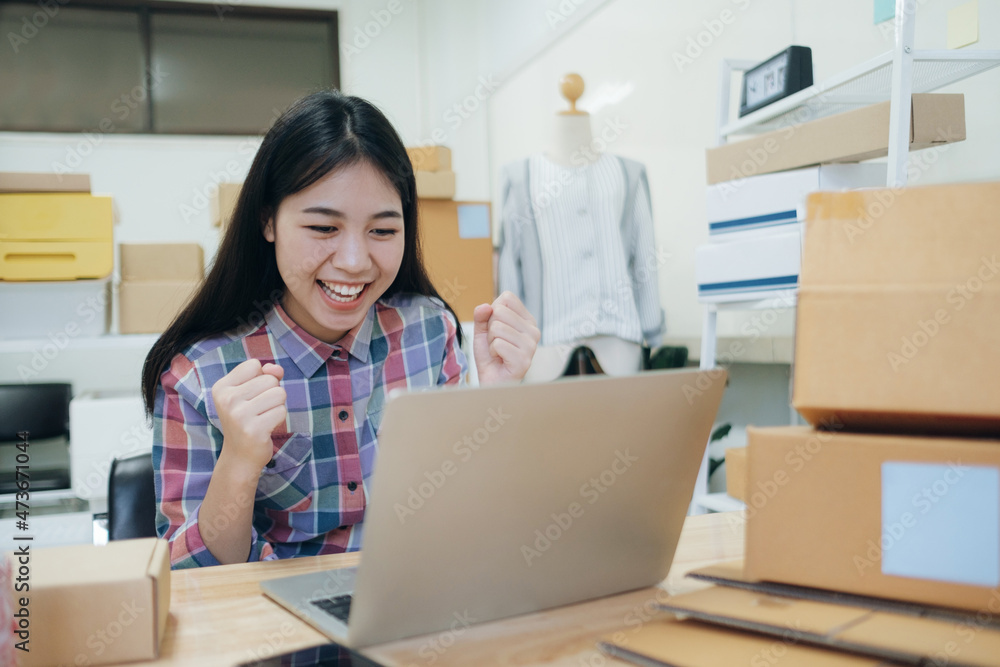 Young asian women happy after new order from customer. Young asian women happy after new order from customer.