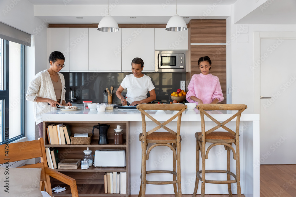Content family cooking together in kitchen Content family cooking together in kitchen