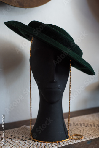 Wedding style velvet hat on a mannequin in the showroom photo