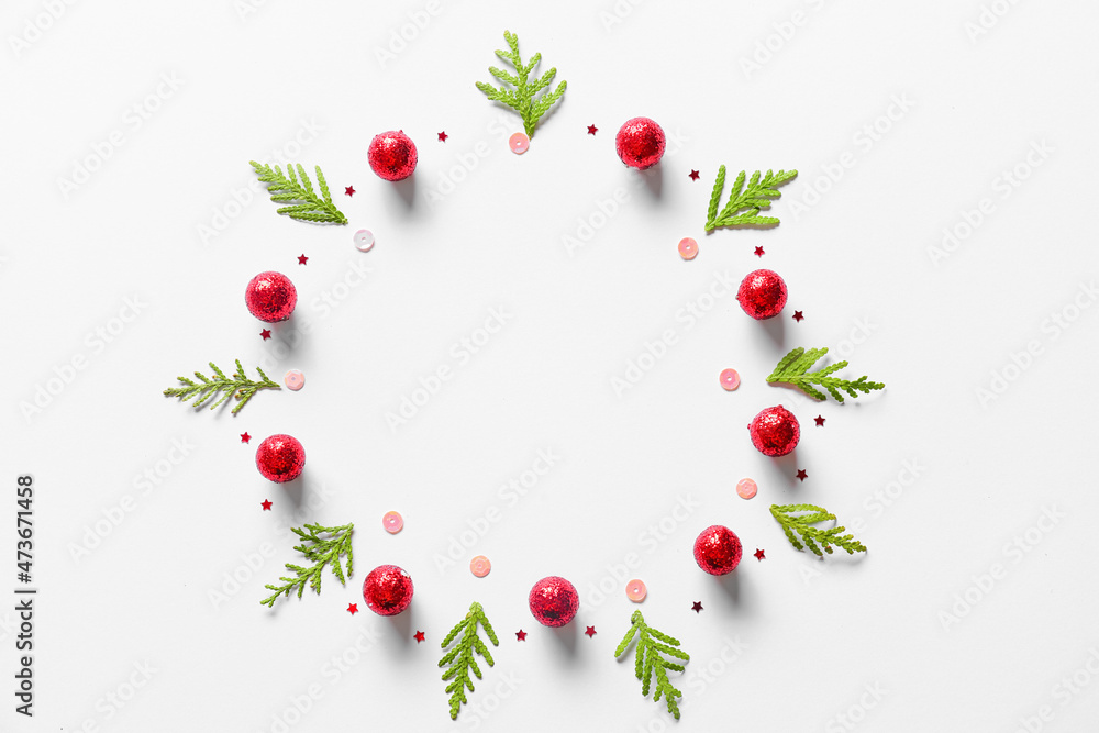 Beautiful Christmas wreath made of fir branches and balls on light background