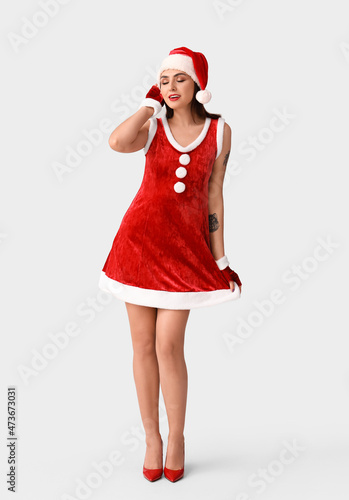 Sexy young woman in Santa c...