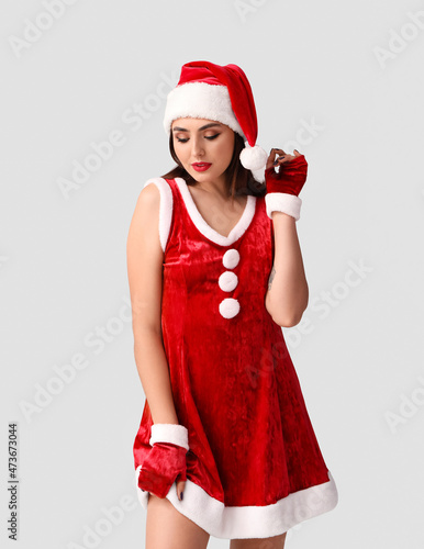 Sexy young woman in Santa c...