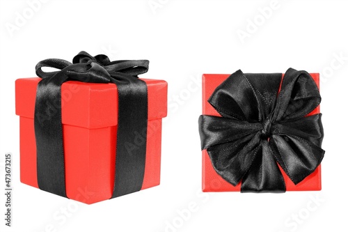Red gift box with black bow on a white background