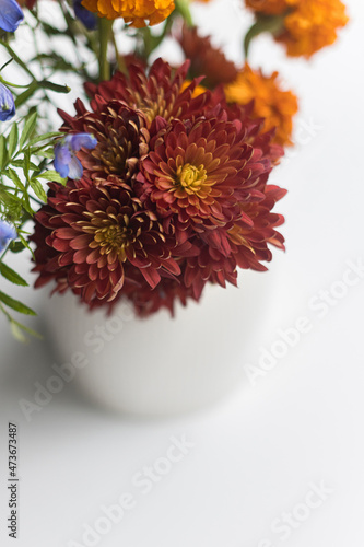  Fall flowers in vase on white background