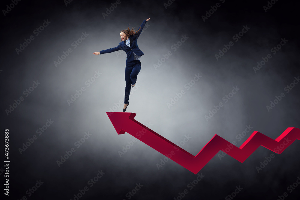 Portrait of energetic businesswoman jumping in open air Portrait of energetic businesswoman jumping in open air