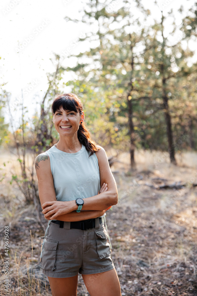 Fit woman looking at camera outside. Fit woman looking at camera outside.
