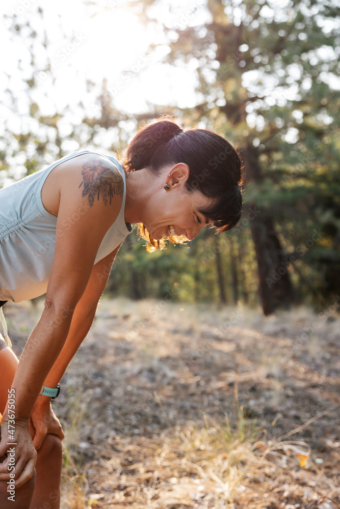 Laughing woman outside after run Laughing woman outside after run