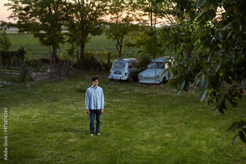 Lonely Man Standing In The Backyard photo