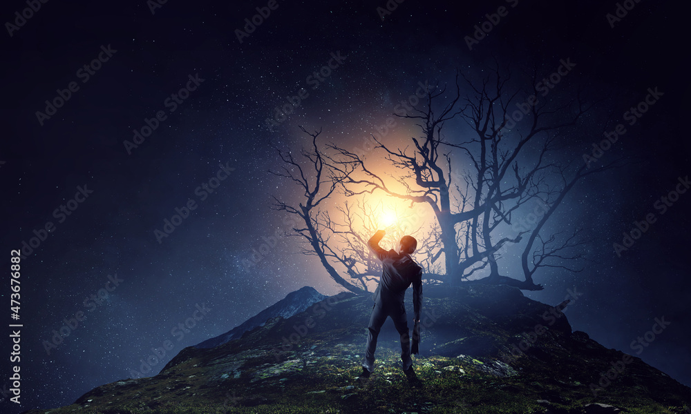 Fototapeta premium Silhouette of businessman in the darkness