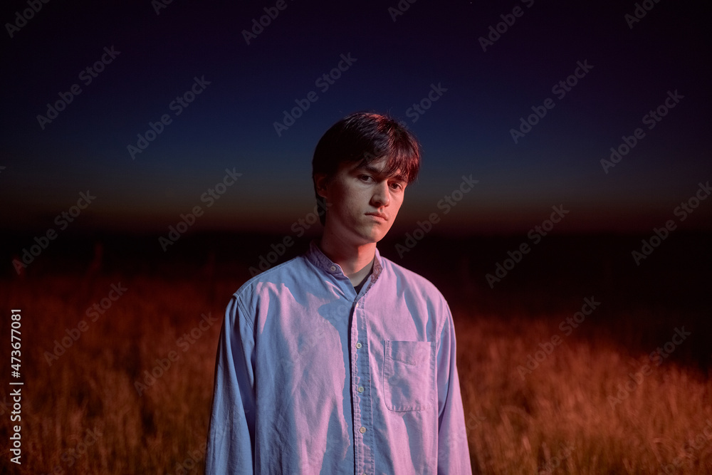 Portrait Of A Caucasian Man Lit By Red Light Portrait Of A Caucasian Man Lit By Red Light