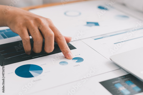 Business people working with graphs, business documents on their desks to analyze for business startups.