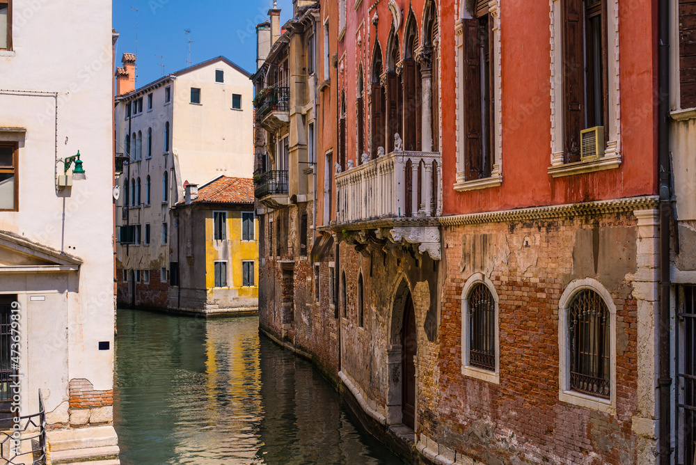 Small Venice channels and old facades on a sunny day