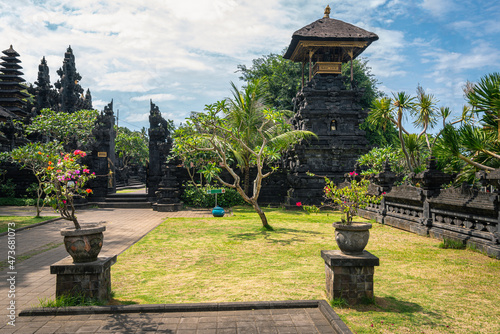 A garden in front of the entrance to Pura Goa Lawah Bat Cave Temple on Bali island in Indonesia. photo