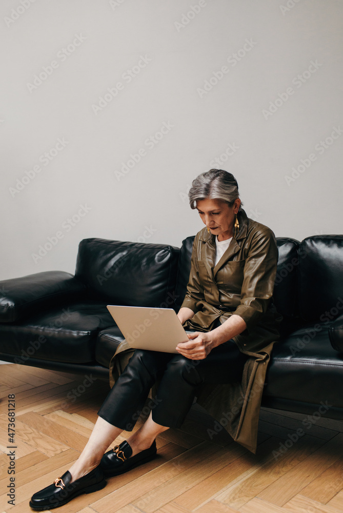Senior businesswoman using laptop - Work from home Senior businesswoman using laptop - Work from home
