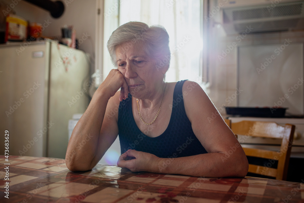 © Nasos Zovoilis/Stocksy - Senior woman looking unhappy