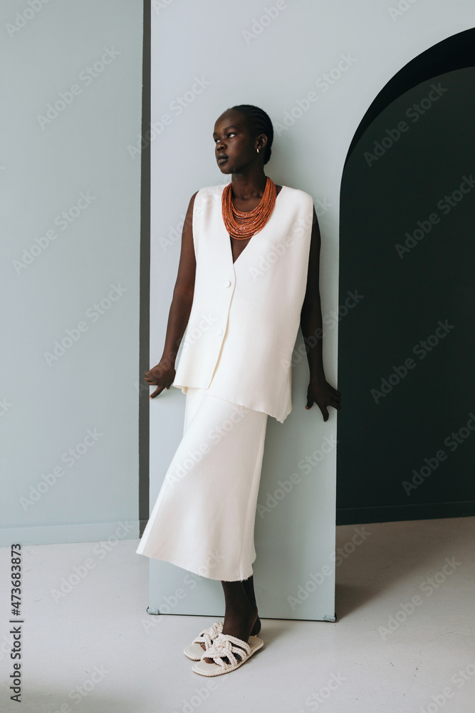 Trendy black female portrait near doorway Trendy black female portrait near doorway