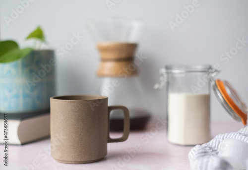 Mug of coffee and collagen on table photo
