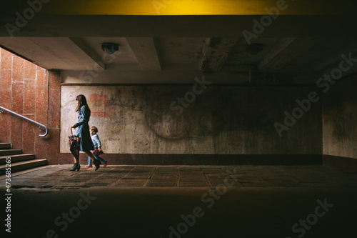 Mother walking with daughter in the city