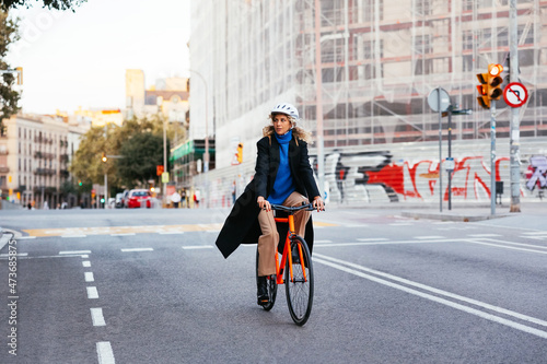 Wallpaper Mural Female riding bicycle in city Torontodigital.ca