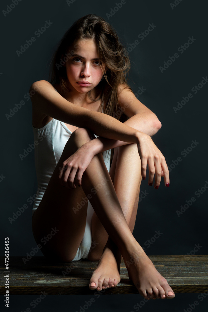 Young model girl with slim body. Sensual woman with shadows on beautiful face. Young model girl with slim body. Sensual woman with shadows on beautiful face.