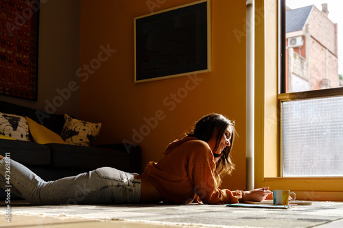 Woman doing homework at home photo