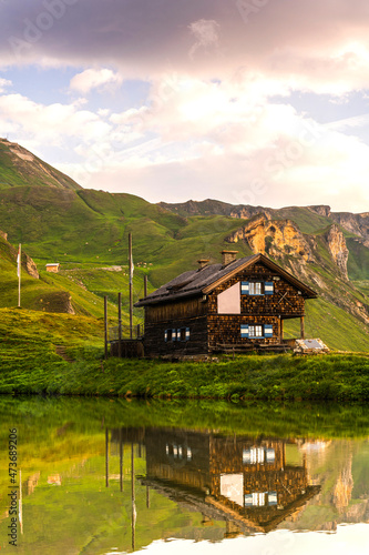 Fototapeta Naklejka Na Ścianę i Meble -  Scenic Viewat High Alpine Lake and Wooden Hut
