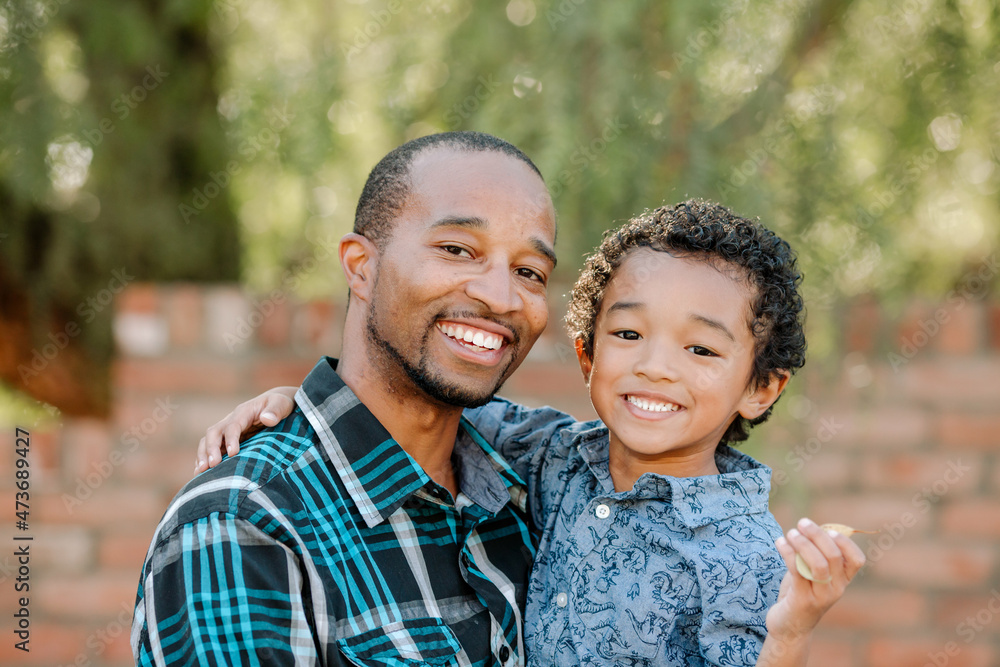 Happy dad and young son outdoors Happy dad and young son outdoors