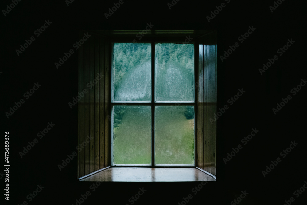 © Haus Klaus/Stocksy - Cabin window © Haus Klaus/Stocksy - Cabin window