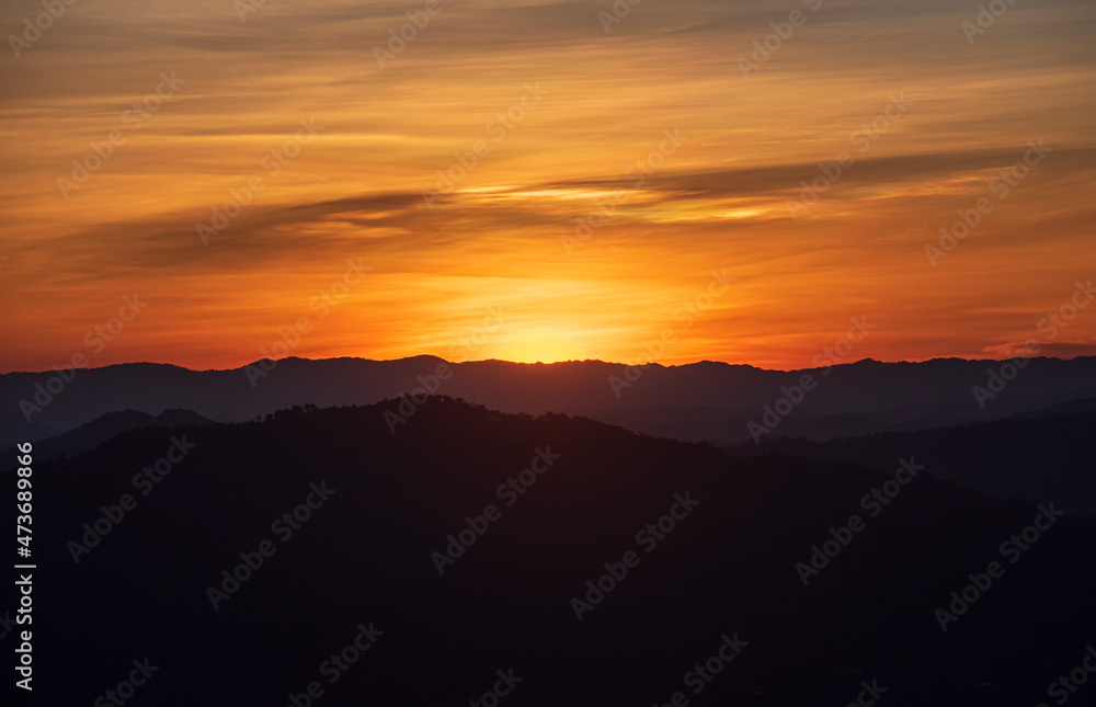 Fototapeta premium Colorful sunset over the mountain hills Thailand