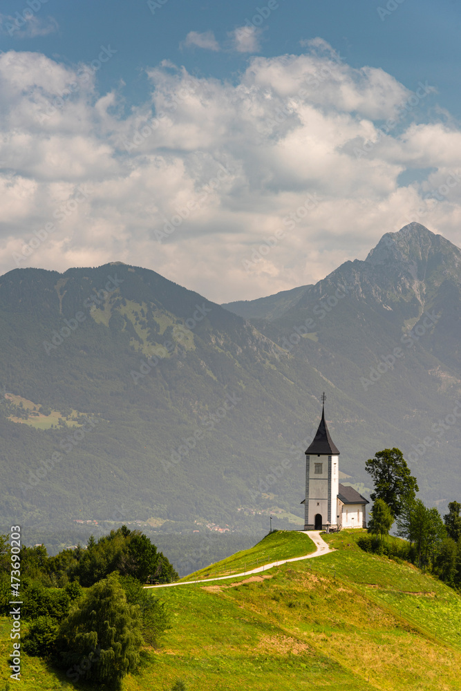 Scenic Church St Primoz in Jamnik Slovenia in Summer at Sunny Day. Alpine Landscape
